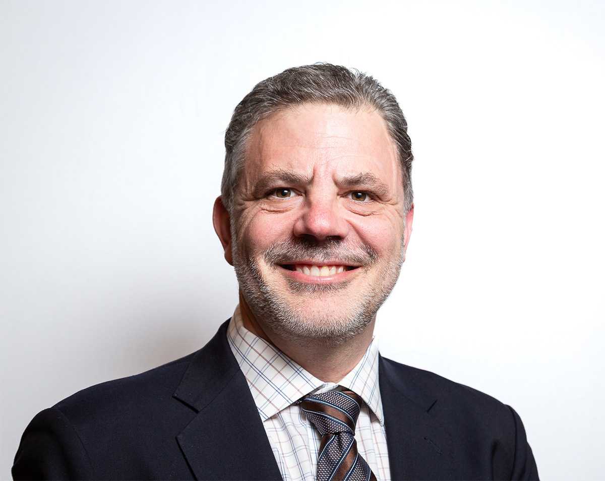 Headshot of Tom Bruister Principal and Senior Director of Occupier Services North America for Avison Young